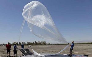 The Project Loon team from Google launches a high-altitude balloon carrying electronic testing equipment into the skies above Dos Palos, Calif., July 26, 2013. 